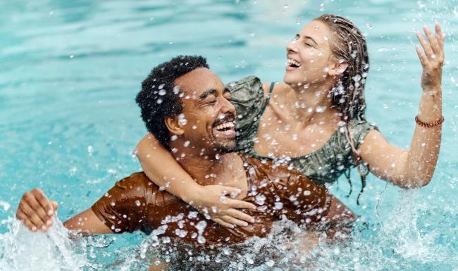 a man and woman in a pool